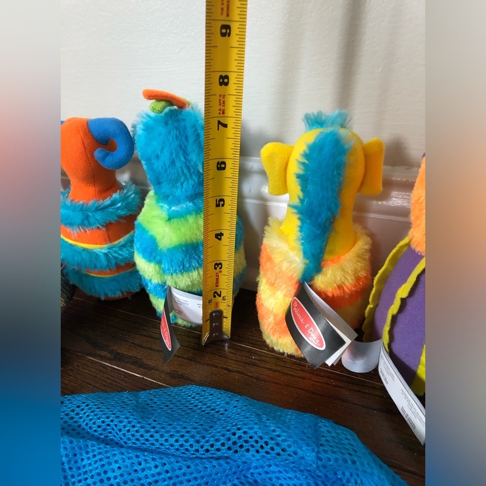 Melissa & Doug 8-Piece Fuzzy Monster Bowling Pin and Ball Set w/Mesh Storage Bag - Picture 5 of 6